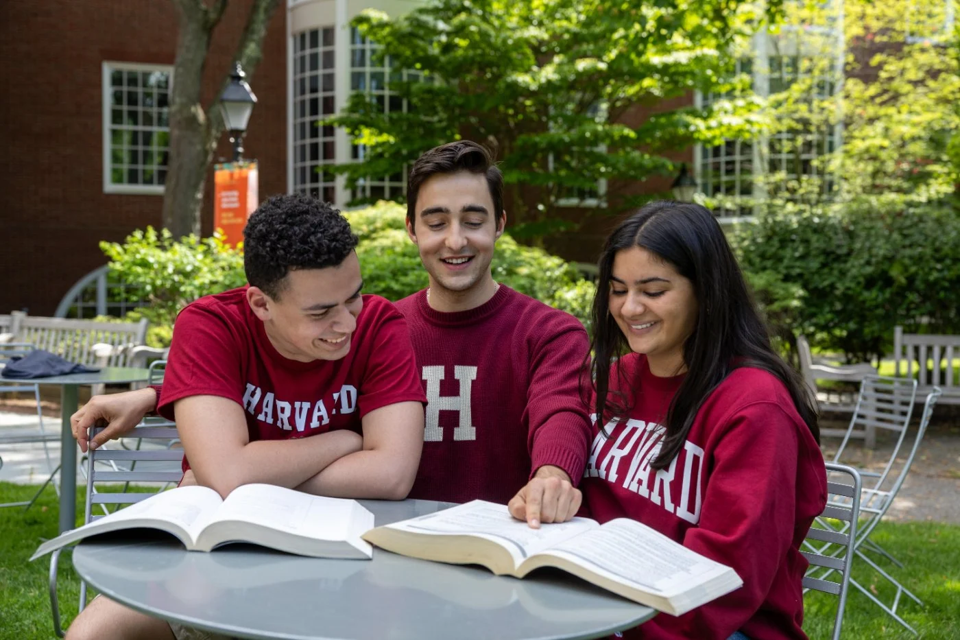 Students comparing ideas together on campus