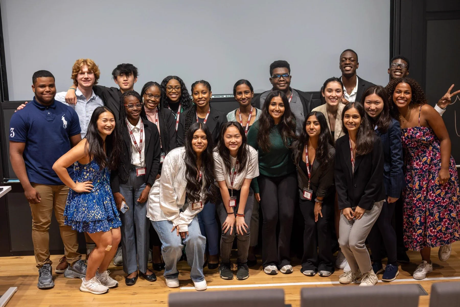 A diverse student cohort together after a learning experience
